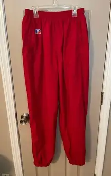 Russell women’s vintage red lined nylon track pants w/pocket zip ankles. Size L