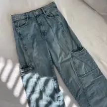 Light wash blue denim jeans with cargo pockets #cargo #denim