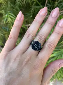 Artisan beaded black flower ring  Can fit side 7-8 because it’s stretchy 