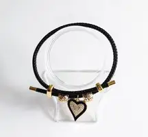 Adjustable steel wire bracelet with charm.