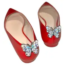 Pretty silver sparkly iridescent butterfly show clips. These are plastic.