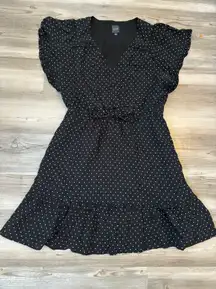 Size Medium Lightweight with light lining, black base with white hearts, with adjustable waist,pit to pit is 19, length is 25