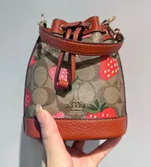 COACH Mini Dempsey Bucket Bag In Signature Canvas With Wild Strawberry CH164
