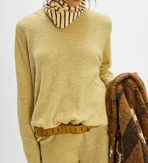 FP Beach slightly sheer light lime green sweater size M used.