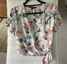 Women size small white Flower top open v neck sheer material wrap to side strap