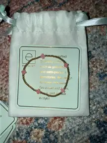 pink cross bracelet