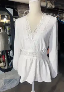 Rose & Grey LOS ANGELES white lace V-neck long sleeve shirt top peplum tie cuff  New with tag  Smoke and pets free  Same day shipping Elevate your wardrobe with this stunning white lace blouse from . The V-neckline and long sleeves add a touch of ele