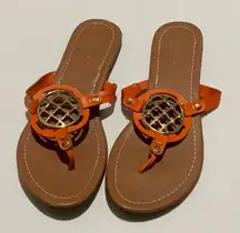 East.1946 Size 8 Sandal, Orange With Gold Colored Medallion.