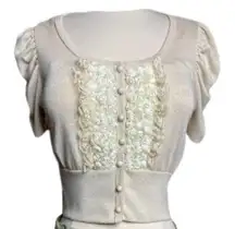 Cropped button-up sweater with rosette insert