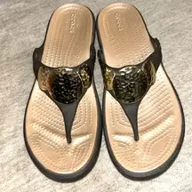 Crocs  flip flops sz 6 wedge brown with gold hammered medallions perfect!