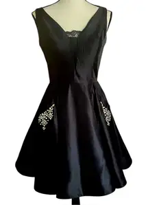 CLARISSE Black V Neck Satin look Rhinestone pockets and lace up back. Size 8