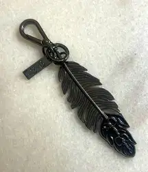 Jessica Simpson Feather Keychain accessory black gunmetal trigger snap Bag Charm