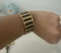 Gold and black metal cuff bracelet