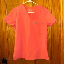 Figs Women’s Catarina One Pocket Scrub Top in color Hot Coral Size XS