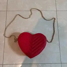 Red heart shaped purse with gold chain