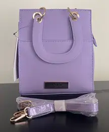 Trina Turk double handle tote in lilac with a removable crossbody strap