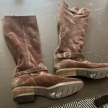riding boots in brown suede. I didn’t see a size anywhere.