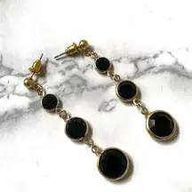 Gold tone and black long circle drop earrings