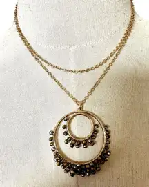 Avon gold tone long beaded circle pendant necklace