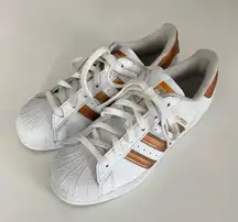 Adidas superstar white and copper sneakers