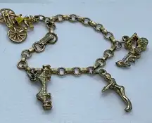 Vintage 6” charm bracelet. Gold tone with crossover clasp.
