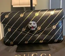 Gucci Double GG Broadway clutch.