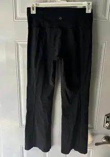 Lululemon black bootcut leggings. No size but fits like a 10. Some wear