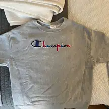 Champion  crew neck sweatshirt gray with red and blue letters