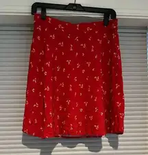 ModCloth knee-length skirt. Red with dainty yellow floral print. Elastic waist.