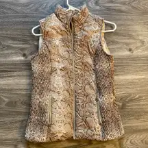 Andrew Marc New York Snakeskin Puffer Vest Women's Size XS.   materia is nylon 100% shell, lining and fill polyester. Pre-Owned. Good condition.