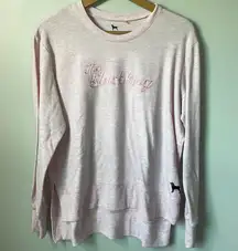 embroidered crewneck in size large. Back hem is longer.