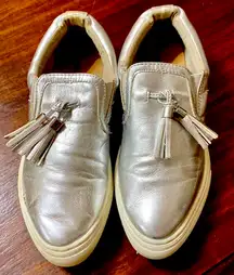 silver slip-on shoes with Tassels