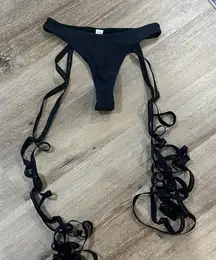 Elegant Black Women's Swimwear - the strings wrap all the way down your leg