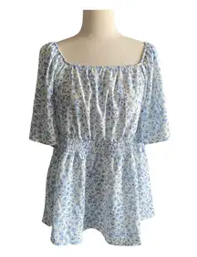 NWT- Adorable white with blue flowers babydoll top, smocked waist, flutter sleeves, brand new, size 14/16 Measurements: Bust: armpit to armpit 21 inches  Waist: side to side 18-24 inches  Length: shoulder seam to bottom 29 inches