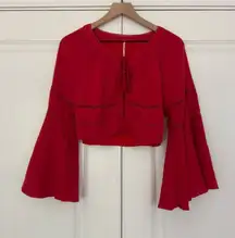 Free People  Mi Corazon Top red long bell sleeve keyhole tie front cutout cotton