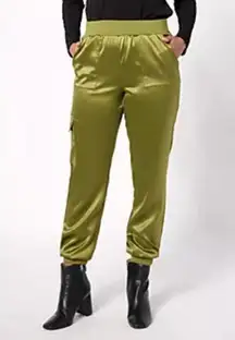 LOGO by Lori Goldstein Regular Satin Cargo Pant with Rib Waistband Size M QVC ASOT Reg $85 NWT  Adjust Text Size: Description Best dressed is in your future when you arrive wearing these sassy satin cargo pants. The casual jogger-style cargos are ideal for any RSVP while the sleek satin fabric elevates the mood to party mode. Such a saucy boss! From LOGO by Lori Goldstein®. Features: pull-on jogger style, ribbed elastic waistband, front pockets, side leg cargo pockets, elastic leg cuffs Rise: at the waist Fit: semi-fitted; follows the lines of the body with added wearing ease Leg Shape: tapered leg; tapers from thigh to narrow opening Inseam: missy/plus inseam 29" Content: 97% polyester/3% spandex Care: machine wash, tumble dry Imported