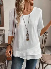 White loose-fitting short-sleeved cotton and linen top