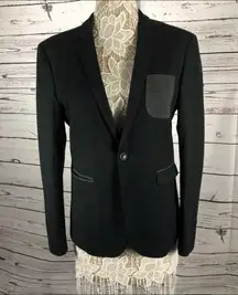 Ladies blazer 
Charcoal in color with gray pocket.