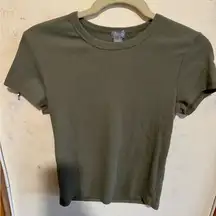 Tilly’s olive green tight fitting tee.