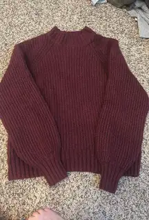 Maroon colored turtleneck sweater