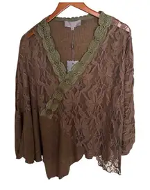 Pretty Angel Brown lace poncho-style blouse with green details, elegant