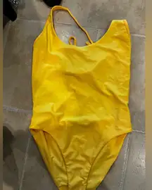 Yellow body suit. Tiger mist