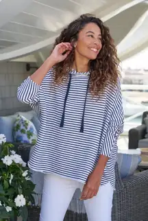 Hand-cut raw hem and edges Rolled funnel neck Elbow-length continuous sleeves Signature capelet side slits  Fabric: 100% Cotton  • Made in Sunny California, USA • Care: Machine wash cold, tumble dry low  This is new without tags F&E is a green company and doesn’t have sale tags.  Inside tag has been cut to prevent store returns  10750