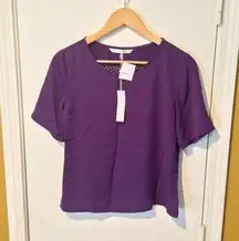 Trina Turk women's "Black Orchid" Hanford cut out back short sleeve shear blouse