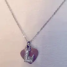Silver heart necklace with "L" charm