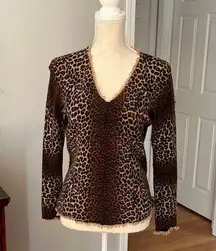 Cashmere animal print, soft sweater, flattering print.