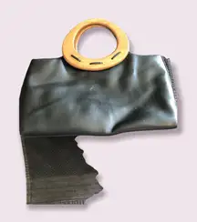 Black Relic handbag with wood handle. 6” x 13”