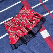 DKNY Jeans red flowy floral mini skirt with a mesh layer 
Women’s size 5