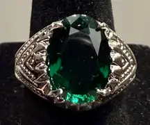 Ring - size 8.25 - silver tone stainless steel with faceted green crystal oval stone. New. Never worn. Smoke free home.