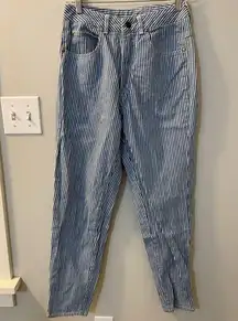 Vintage blue & white striped tapered jeans w/ zippers at the ankle. Size 6